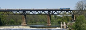 VIA train on a bridge in the Corridor