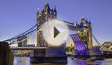 Opening of Tower Bridge in London at sunset.